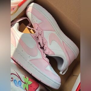 Pink kids Nike shoes
